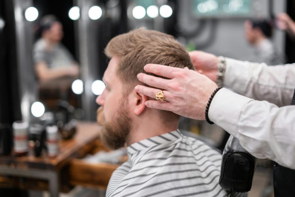 Photo of a Barber Giving a Haircut